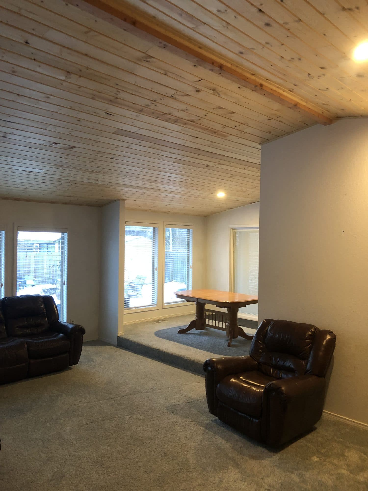 Finished family room addition with wood ceiling