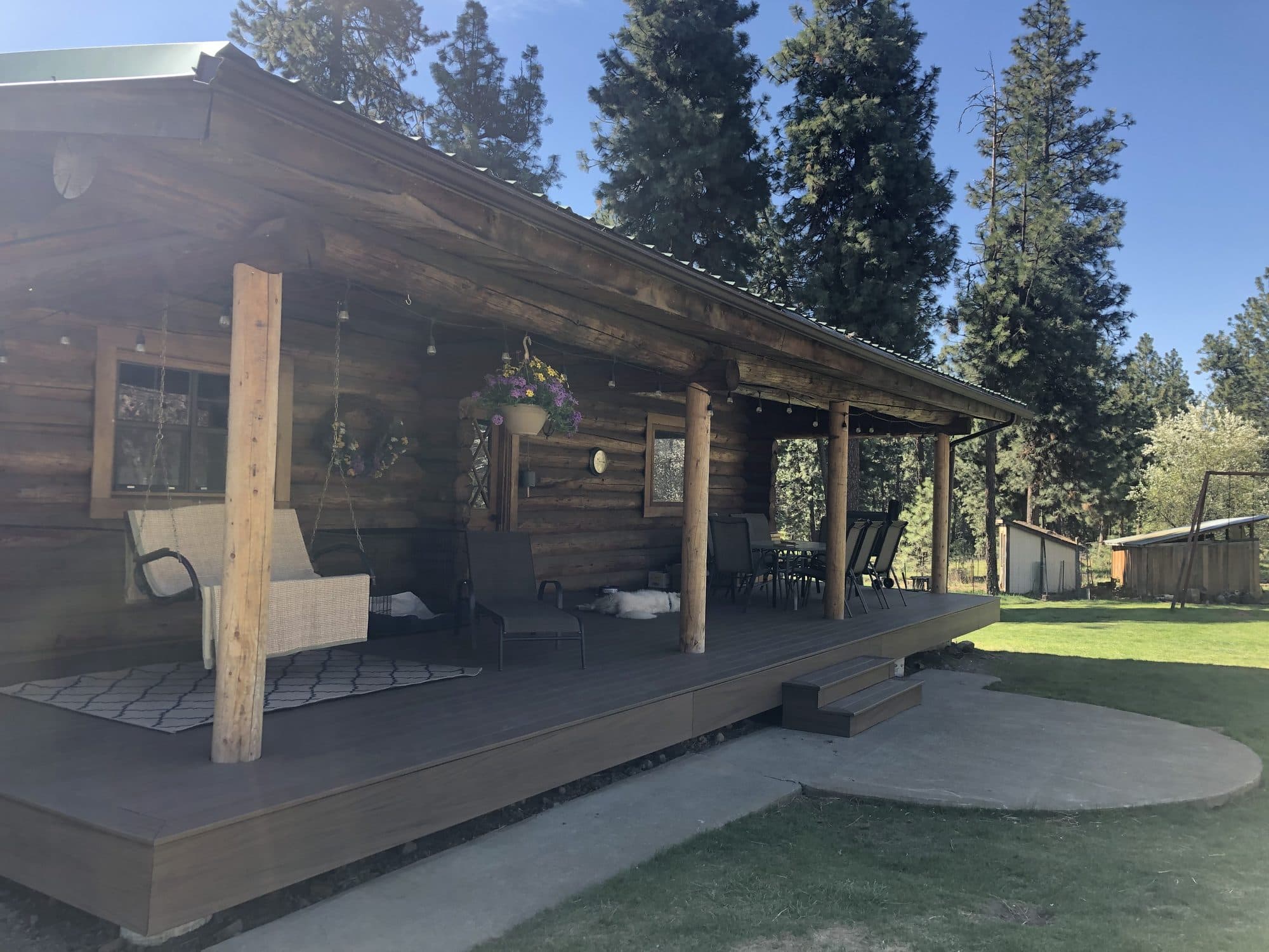 Covered log cabin porch and deck