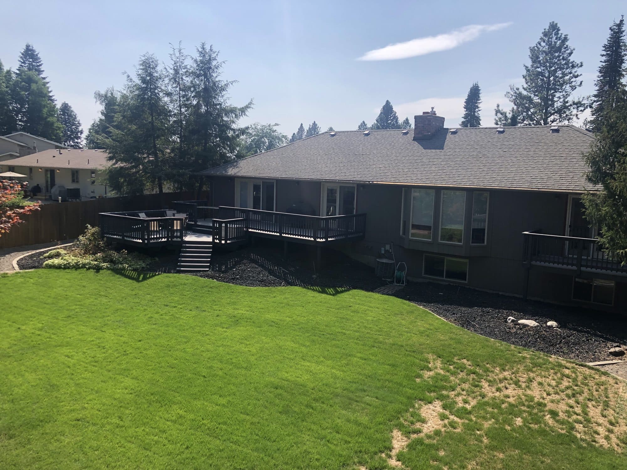 Deck overlooking backyard lawn