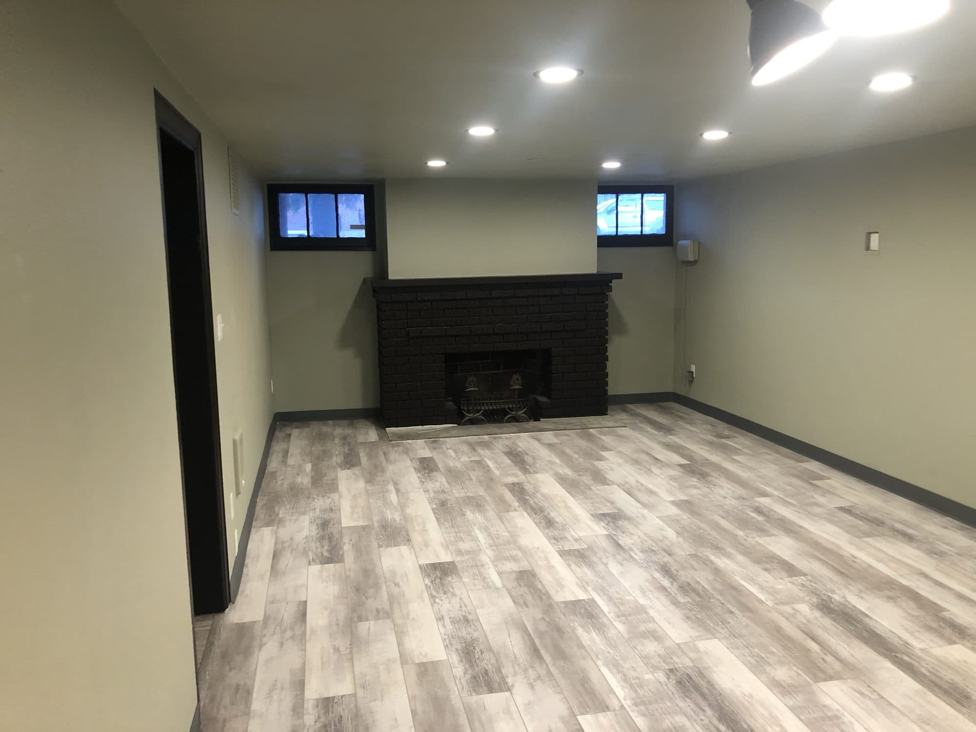 Finished living room with fireplace